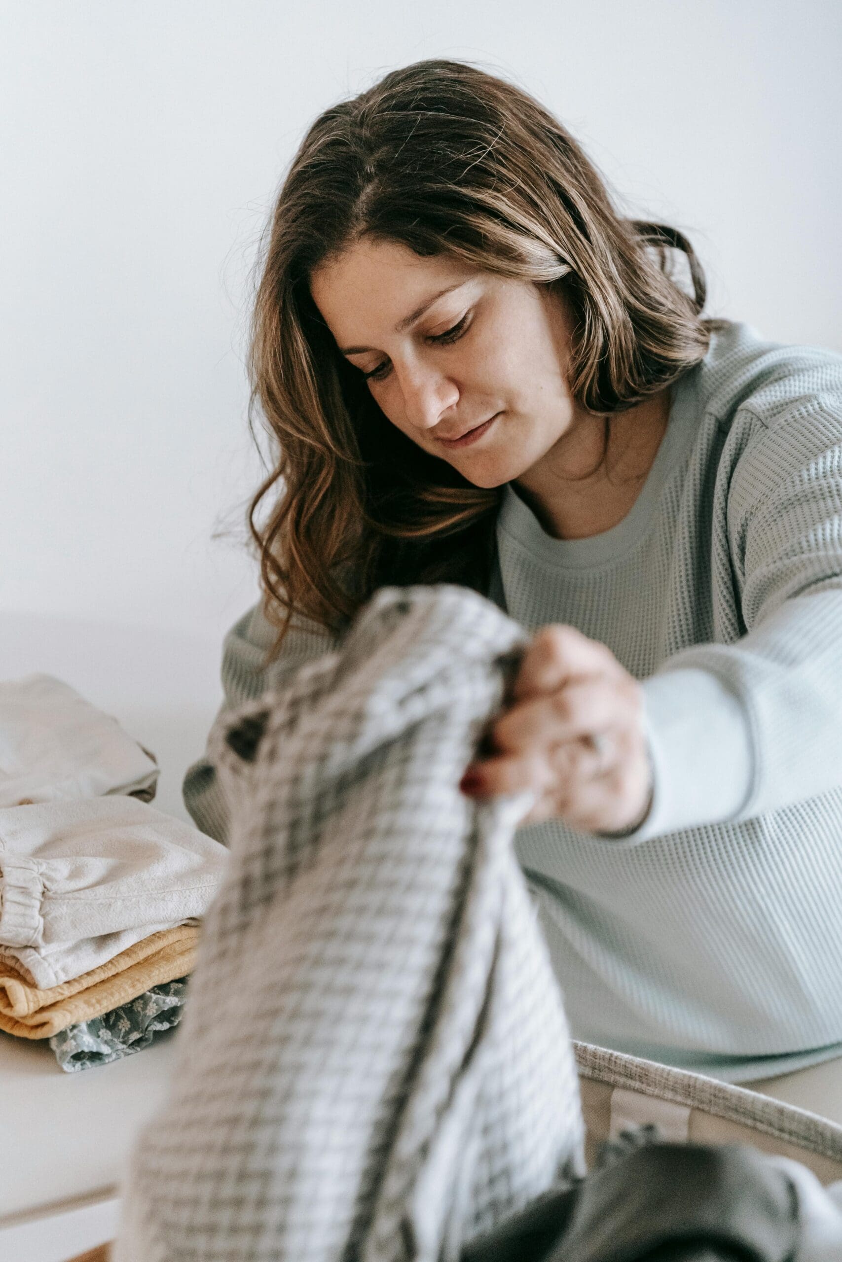 woman folding laundry